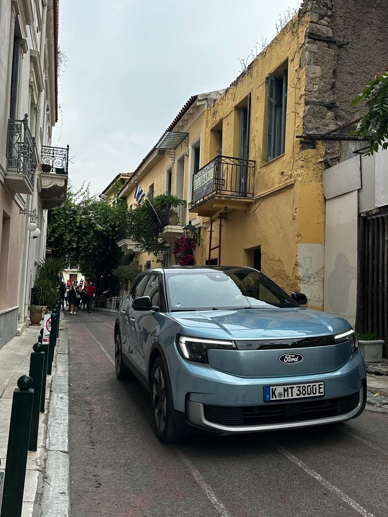 blue car in european street
